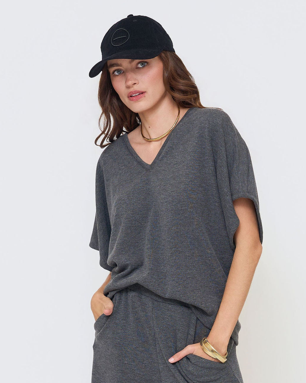 Modern women’s outfit from TheKno featuring flowy V-neck design